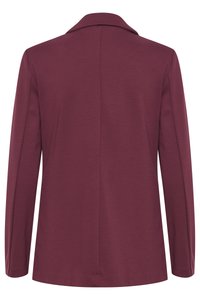 Bordeaux kavaj i slät textil, med slogkrage, långa ärmar och rak bak med en ren avslutning.