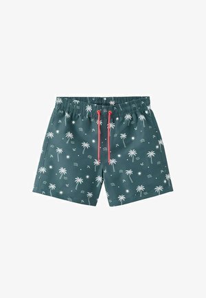 Shorts de bain vert foncé avec des motifs blancs de palmiers, de soleil et de vagues, dotés d'un cordon rouge à la taille élastique.
