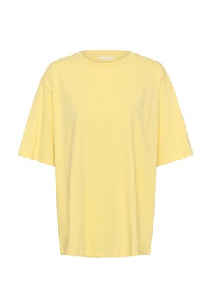T-shirt à manches courtes et col rond, coupe ample, de couleur jaune pastel avec un logo brodé discret sur le côté gauche de la poitrine.