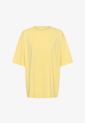 Loszittend T-shirt met korte mouwen en een ronde hals in pastelgeel, met een subtiel geborduurd logo op de linkerbuste.
