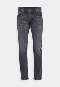Slim fit kavbojke v temno sivi denim tkanini, z diskretnim poškodbami, klasičnim petim žepom, gumbnim zapiranjem in ravnim krojem.