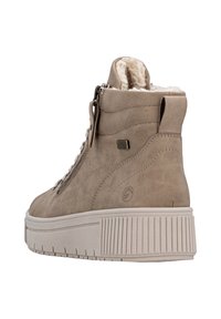 Beige enkellaarzen met een gestructureerde nubuck bovenkant, een leren voering, en een dikke, geribbelde rubberen zool; voorzien van een zijrits en veters aan de voorkant.