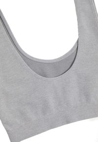 Grå randig tygbralette med en bred rund halsringning och tjocka band. Slät textur med en åtsittande passform och ingen synlig hårdvara.