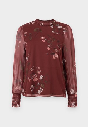 Dlhá priehľadná bordová blúzka s ružovým kvetinovým vzorom, vysokým nariaseným výstrihom a nariasenými manžetami.