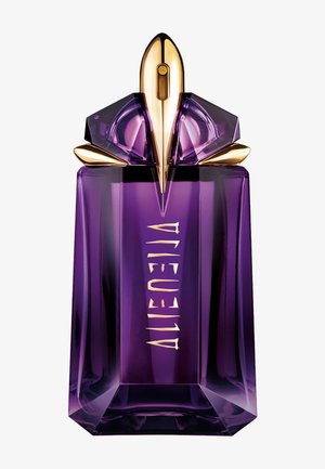 Flacon de parfum violet facetté avec un pulvérisateur doré en forme de fusée et le mot "ALIEN" en lettres dorées stylisées sur le devant.