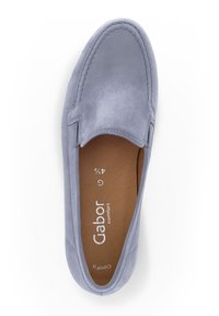 Light blue leather slip-on shoe with a rounded toe, minimal stitching details, and a beige insole featuring brand name and size markings.