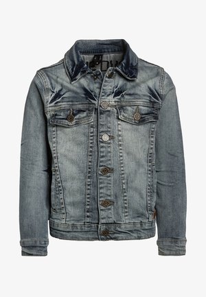 Denim jacket in light blue with a faded wash, featuring a classic collar, front button closure, and two chest pockets. Silver hardware accents.