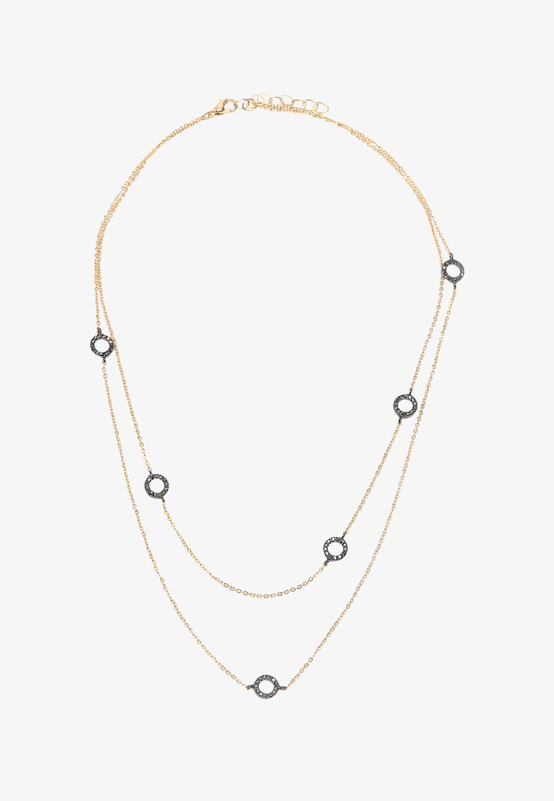 Naszyjnik warstwowy w złotym odcieniu, składający się z dwóch łańcuszków. Na całości równomiernie rozmieszczone okrągłe czarne akcenty z metalicznymi detalami.