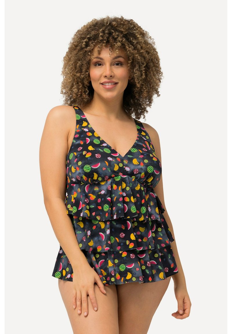 Top da bagno nero con strati di volant, caratterizzato da un vivace motivo di frutta in colori come il rosa, il giallo e il verde. Design a V con spalline larghe.