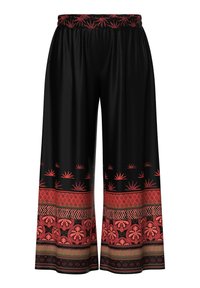 Pantalon noir à jambes larges avec motifs floraux et géométriques rouges en bordure et taille élastique avec motifs rouges assortis.