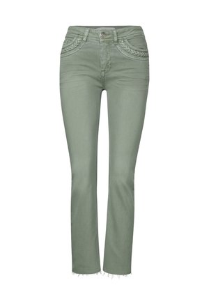 Gröna denimjeans med en figurnära design, lätt utsvängning vid ankeln, fransar i fållen och dekorativ sömnad på framfickorna.