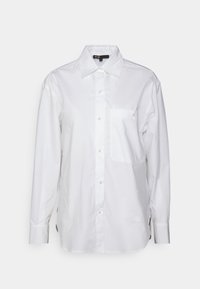 Camicia bianca con bottoni realizzata in cotone. Caratterizzata da un colletto a punta, maniche lunghe, tasca sul petto e un dettaglio logo discreto di lato.