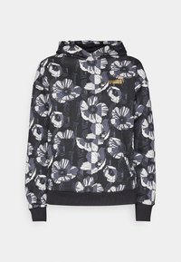 Schwarze Kapuzenjacke mit großem Blumenmuster in Weiß und Grau, mit Kängurutasche vorne und goldenem Puma-Logo auf der Brust.