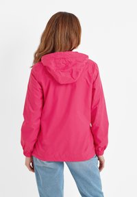 Lightweight pink rain jacket with a hood, elastic cuffs, and a loose fit. Smooth texture, designed for comfort and weather protection.