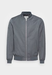 Chaqueta bomber gris hecha de tejido suave. Presenta un cierre de cremallera en el frente, pu�ños y dobladillo acanalados, y bolsillos laterales. Diseño minimalista.