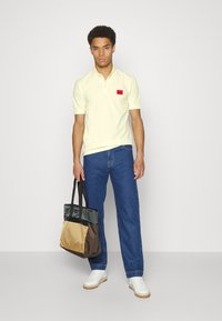 HUGO DERESO - Polo - light pastel yellow