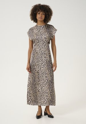 Leopard print maxi dress with cap sleeves, soft fabric, and a flowing design. Worn with black slingback heels.