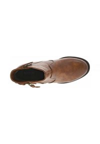 Bottine en cuir marron avec un bout arrondi, fermeture éclair sur le côté et couture minimale. Texture lisse avec une finition mate. Doublure intérieure noire.