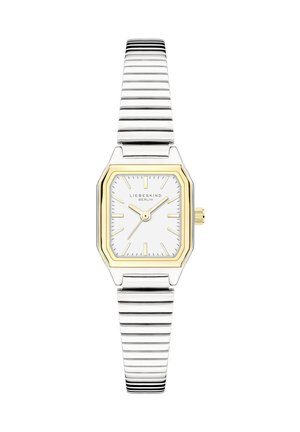 Silberne und goldene Armbanduhr mit rechteckigem weißen Zifferblatt, goldenen Stundenmarkierungen und Zeigern sowie einem dehnbaren Metallarmband.