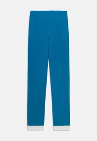 Blaue Jogginghose mit einer weichen Textur, elastischem Bund und weißen Bündchen am Beinende. Einfaches und gerades Design.