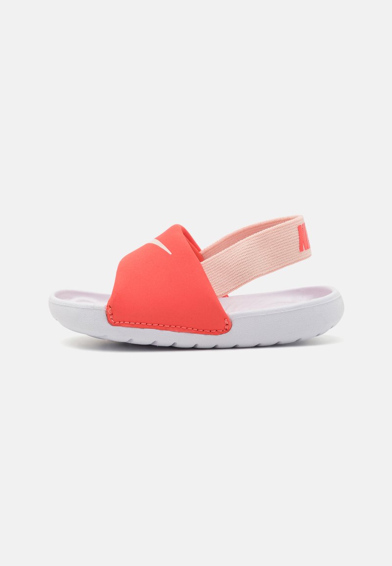 Pink and coral sandals with a soft upper strap, adjustable elastic heel strap, and white rubber sole featuring textured tread.