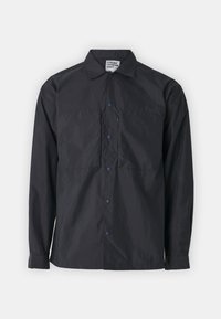 Black, lightweight jacket with a button-up front, two chest pockets and blue snap buttons, featuring a collar and long sleeves. Suitable for outdoor use.
