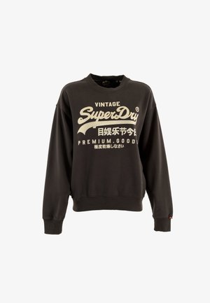 Sudadera negra con cuello redondo, puños y dobladillo acanalados. Presenta un texto impreso en blanco en negrita: "VINTAGE SuperDry PREMIUM. GOOD."
