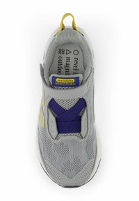 Gray sneaker with mesh upper, purple elastic band, yellow back pull tab, and gray sole. New Balance branding in blue on tongue.