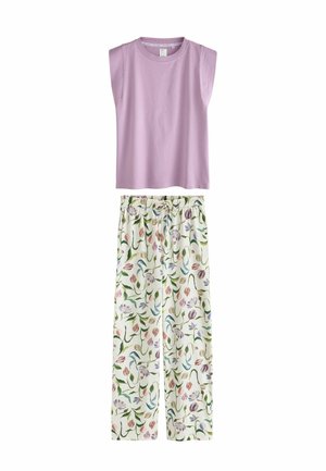 Ärmelloses fliederfarbenes Top kombiniert mit weißen, locker sitzenden Hosen mit einem bunten Blumenmuster und einem elastischen Bund mit Kordelzug.