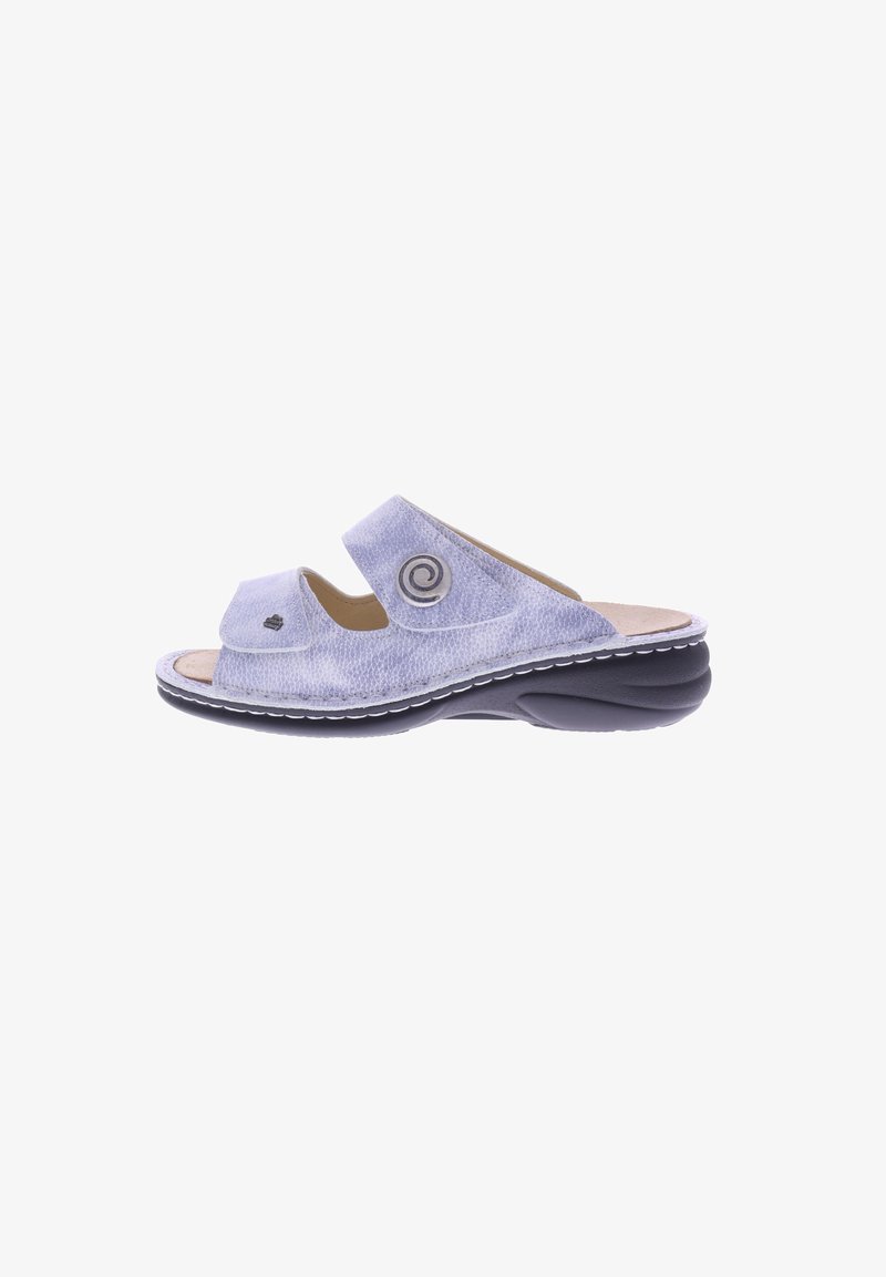 Light blue sandals with a textured fabric upper, two adjustable straps, and a molded black sole; features a circular accent detail.