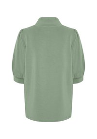 Green short-sleeve shirt with a collared neck and puffed sleeves. Smooth texture, casual fit, and simple design with no visible patterns.