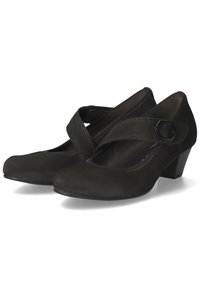 Black suede low-heeled shoes with a rounded toe and an adjustable strap across the instep, featuring a decorative circular buckle.