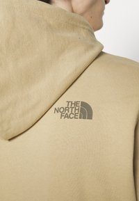 The North Face Jersey con capucha - sand