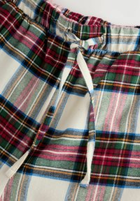 Geruite pyjamashorts in een patroon van wit, rood, groen, blauw en geel. Elastische tailleband met een trekkoord. Zachte stofstructuur.