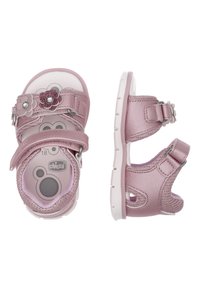 Sandales pour filles roses avec une tige en textile, deux sangles Velcro réglables, des accents floraux et une semelle blanche rembourrée.