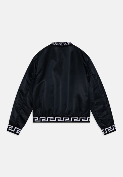 Black satin bomber jacket with a round neckline and white Greek-style pattern at the hem and cuffs. Features a smooth, shiny texture.
