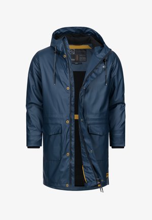 Marineblå vandtæt parka med hætte, lynlås og trykknaplukning. Har to frontlommer og en kontrasterende inderside.