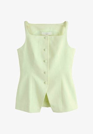 Ærmeløs lysegul hørtop med stofbetrukne knapper foran og en lille slids foran ved kanten.