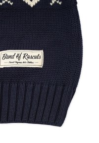 Navy blue knitted fabric with ribbed edge and a white cloth label reading Band of Rascals, Finest Organic Kid's Clothes.