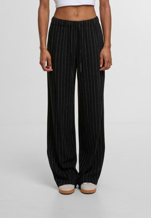 - Spodnie materiałowe