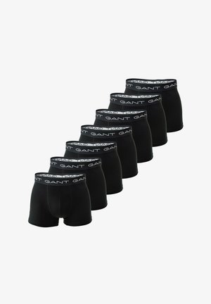 Seitsme musta bokserpüksi komplekt, mis on valmistatud venivast puuvillast, sisaldades pehmet elastset vöökoht, millel on korduv valge brändingutekst.