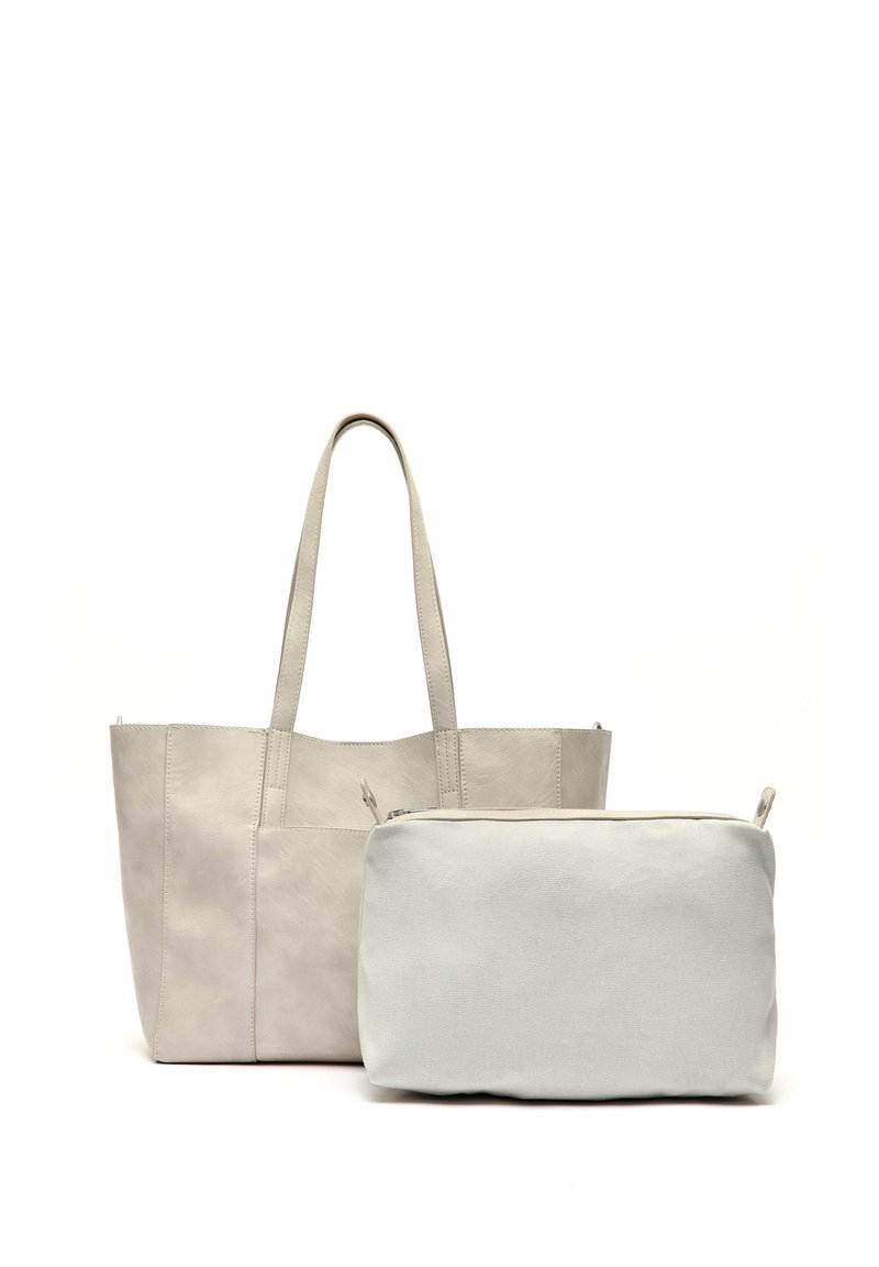 Heled hall nahkade kokkuvöötatud kott, millel on kaks käepidet, tekstureeritud pind ja struktureeritud disain, koos väiksema sobiva kotiga.