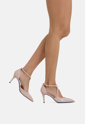 Pink patent leather high-heeled shoes with pointed toe, ankle strap, and blue sole detail, featuring a cutout design and slim heel.