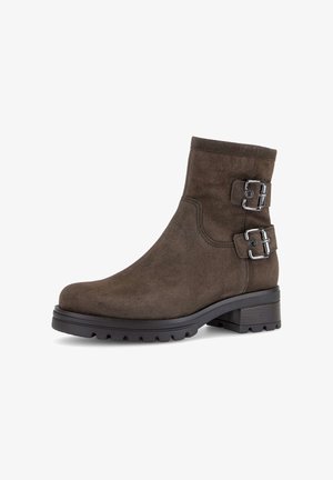 Brown suede ankle boots with two silver buckles, rounded toe, and a textured sole, featuring a low block heel for stability.