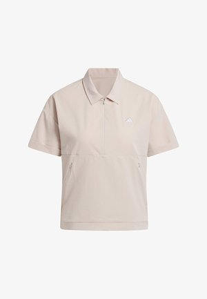 Lichtbeige shirt met korte mouwen, kraag, ritssluiting en twee zijzakken. Bevat een subtiele ribbelstructuur en een klein wit logo.