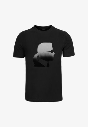 Černé bavlněné tričko s grafickou potiskem stylizovaného profilu se slunečními brýlemi, přecházejícího z světle šedé do tmavě šedé.