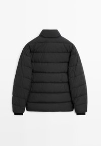 Black puffer jacket with a quilted design. Features a collar and elastic cuffs. Smooth texture with a modern, minimalist shape.