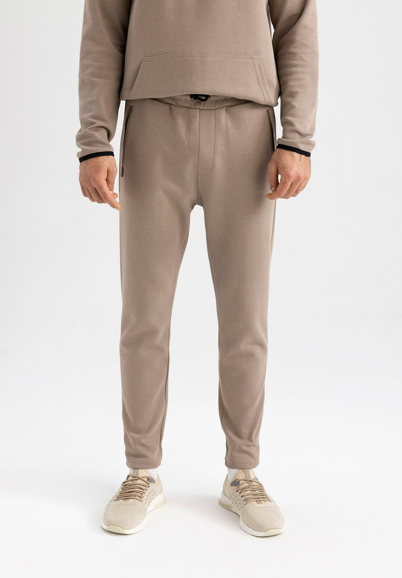 DeFacto SLIM FIT Tracksuit bottoms beige Zalando.de