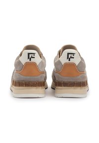Gray suede sneakers with a brown leather accent, a white heel tab featuring a black logo, and a textured rubber sole.