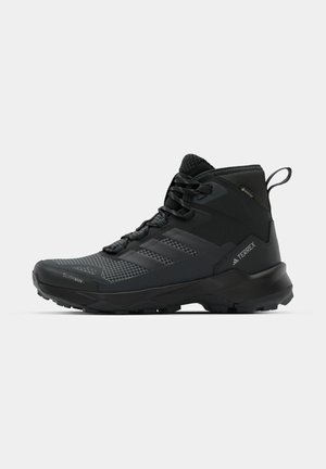 adidas Terrex, SKYCHASER AX5 MID GTX - Winter boots - core black/carbon